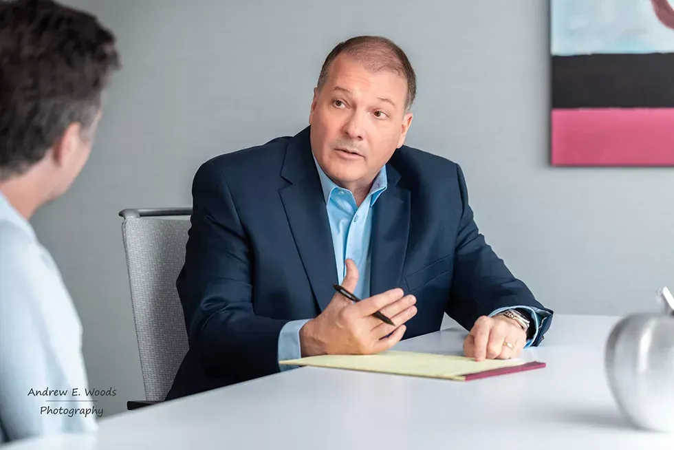 Mark Shelby speaking with a client
